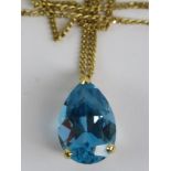 An 18ct gold pendant set with large teardrop cut blue topaz approx 6.