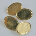 A pair of 9ct gold cufflinks having engine turned pattern upon, hallmarked 375, 8.5g.