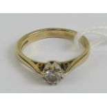 A 9ct gold diamond solitaire, the round cut brilliant diamond in white metal raised claw setting,