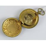A gilt brass sprung Sovereign holder with captive ring.