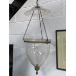 A delightful 19th century glass hanging hall storm lantern having rimed hemispherical top,