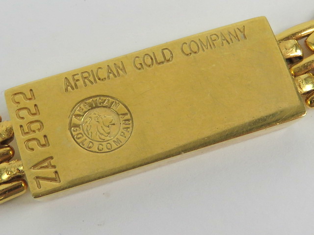 A yellow metal bracelet having 'ingot' style central panel marked 'African Gold Company', - Image 2 of 2