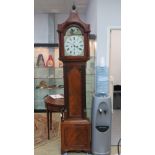 An eight day striking long case clock.