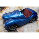 A c1950s Austin J40 pedal car in blue and in original condition measuring 155cm in length,