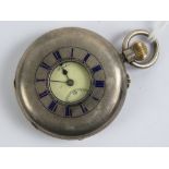 A HM silver top winding half hunter pocket watch having blue enamel Roman numerals to front,