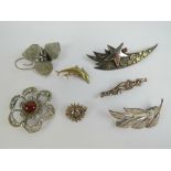 Seven silver brooches being; sterling silver flower, filigree flower with carnelian cabachon,