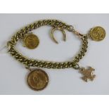 A yellow metal charm bracelet having rose metal horseshoe and Maltese cross charms,