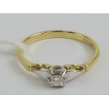 An 18ct gold solitaire diamond ring, the round cut brilliant diamond approx 0.