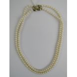 A double strand cultured pearl necklet, each white pearl being approx 39mm diameter,