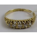 An 18ct gold and diamond carved head ring, having five graduated round brilliant cut diamonds,