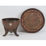 An Arts and Crafts copper tripod bowl with hammered finish and inset with white metal thistle
