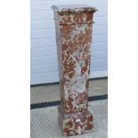 An original solid rouge marble torchere stand, tapering to the base, flat back,