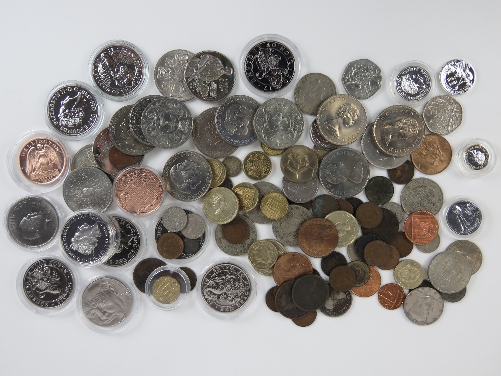 A quantity of commemorative coins including ten crowns in protective pods, sixteen loose crowns,