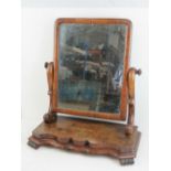 A 19th century walnut toilet mirror, original mercury dipped glass within square shaped frame,