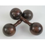 A pair of late Victorian dumbells in rosewood, each 25cm in length.