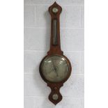 A four glass wheel barometer featuring hydrometer, thermometer, barometer and level,