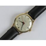 A gentlemans 9ct gold Chalet manual wind wristwatch having silvered dial and blued steel hands,