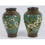 A good pair of Doulton Lambeth relief baluster vases, possibly designed by Mary Aitken,