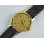 A ladies 1970s Omega De Ville manual wind wristwatch on leather strap, gold plated case,