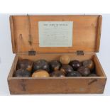 A vintage pine box bearing original label Geo G Bussey and Co's lawn bowls,