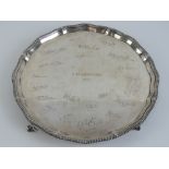 A HM silver salver engraved 'HMS Dragon 1933' bearing twenty-one engraved signatures upon,