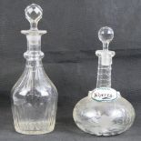 Two glass decanters, on with ceramic Sherry label upon.