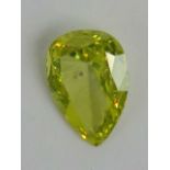 A 0.5ct canary yellow pear cut diamond, loose in protective case.