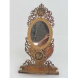 A delightful fretted ladies easel mirror having floral inlaid decoration, 40cm in length.