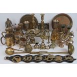 A quantity of silver plated and brass wares including ladles, trivet, pair of candlesticks,
