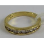 An 18ct gold and diamond half eternity ring having eight brilliant round cut diamonds in channel