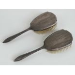 A pair of HM silver dressing table brushes.