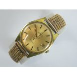 A vintage Omega automatic wrist watch having gold plated case, champagne dial with date aperture,