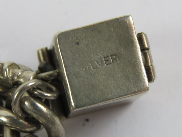 An HM silver curb link charm bracelet having heart padlock clasp and assorted silver and white - Image 3 of 4