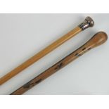 A HM silver topped walking cane, together with a turned wooden walking cane. Two items.