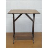 A single mahogany occasional table raised over bamboo effect supports with solid stretcher.