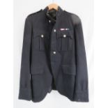 A British Officers blues jacket together with camo jacket and trousers,