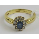 An 18ct gold Ceylon blue sapphire and diamond floral cluster ring,