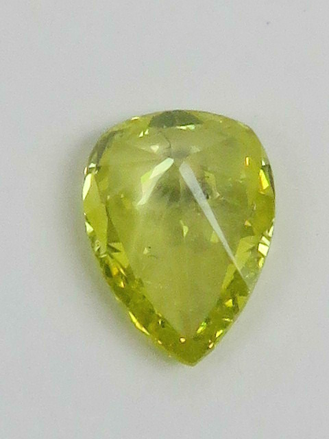 A 0.5ct canary yellow pear cut diamond, loose in protective case. - Image 2 of 3