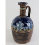 A Doulton Lambeth 'Scotch' whisky jug, i