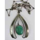 A large silver and malachite pendant, th