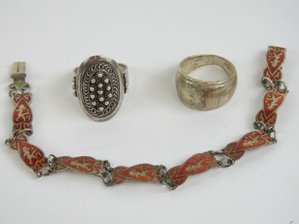 A sterling silver and red enamelled brac