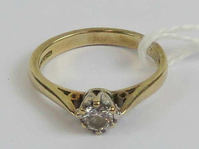 A 9ct gold diamond solitaire, the round