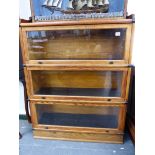 A GLOBE WERNICKE TYPE THREE SECTION OAK BOOKCASE ON PLINTH BASE. W.87 x H.119 x D.29cms.