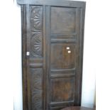 A 17th.C.OAK PANEL MOUNTED AS A HEADBOARD. W.184cms.