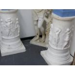 A PAIR OF ANTIQUE TERRA COTTA CLASSICAL DESIGN GALLERY PEDESTALS NOW PAINTED WHITE WITH FIGURAL