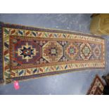 AN ANTIQUE CAUCASIAN KAZAK RUG. 287 x 90cms.