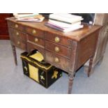 AN EARLY 19th.C. MAHOGANY WRITING OR DRESSING TABLE WITH CROSS BANDED TOP OVER SIX DRAWERS AND