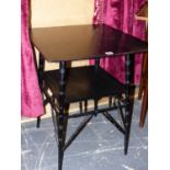 AN EBONISED ARTS AND CRAFTS STYLE OCCASIONAL TABLE.