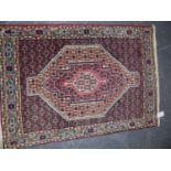 THREE PERSIAN MATS TOGETHER WITH TWO ORIENTAL DESIGN MATS. LARGEST 107 x 76cms. (5)