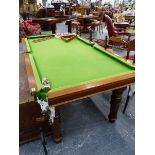A LATE VICTORIAN MAHOGANY QUARTER SIZE SNOOKER TABLE ON TURNED SUPPORTS.